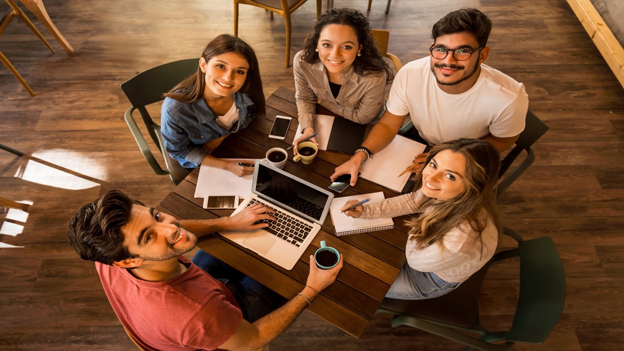 Group of friends studying together for finals