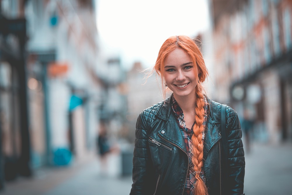 Woman posing on the street in London. She is looking at camera.